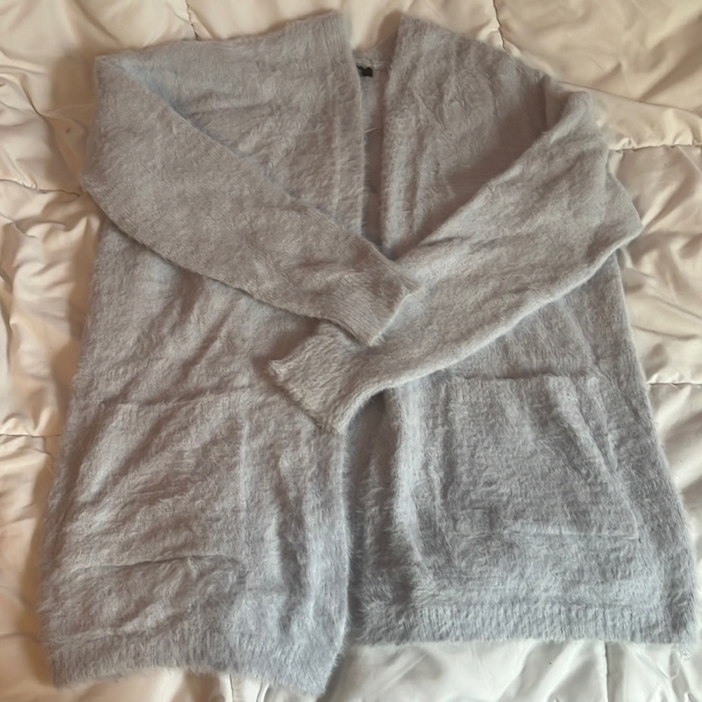 Long, large forever 21 cardigan with pockets! It is a shaggy light blue material